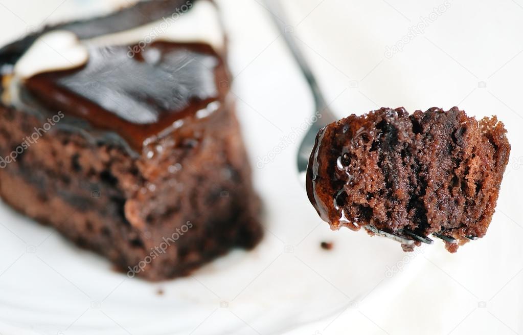Piece of chocolate cake on the fork