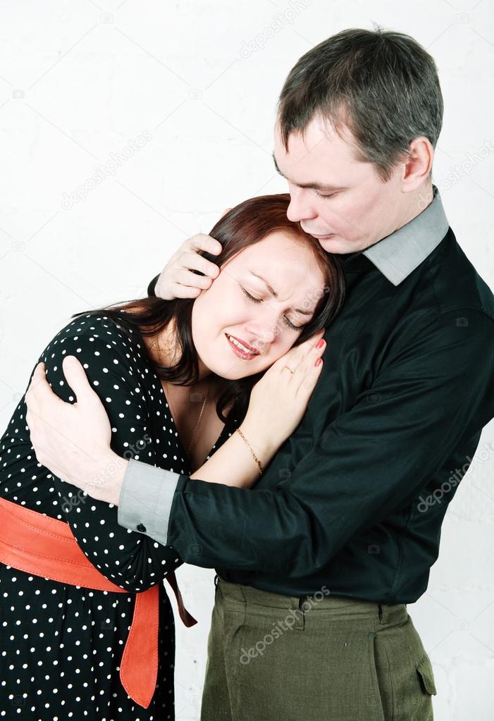 Man comforting his crying woman