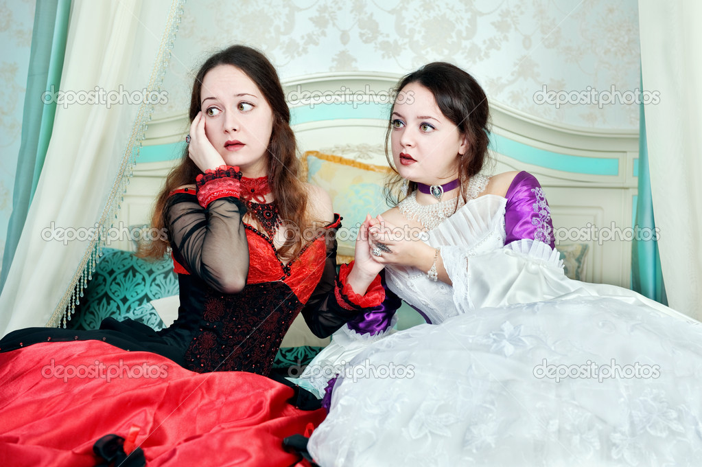 Two women sisters in medieval dresses