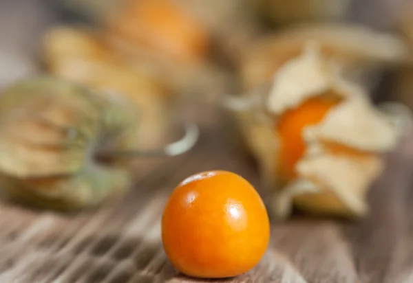 Physalis on the wooden background — Stock Photo, Image