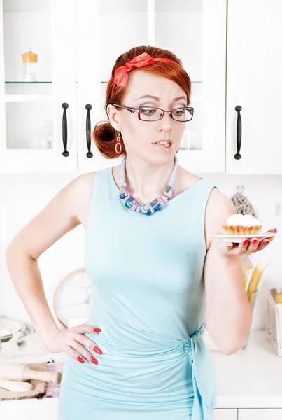 Beautiful woman looking on cake — Stock Photo, Image