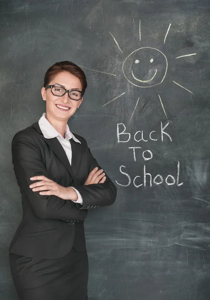 Happy teacher and smiling sun on the chalkboard — Stock Photo, Image