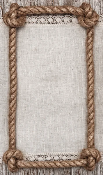 Touw frame, linnen stof en hout achtergrond — Stockfoto