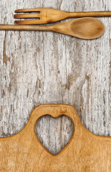 Kitchen utensils on the old wood background — Stock Photo, Image