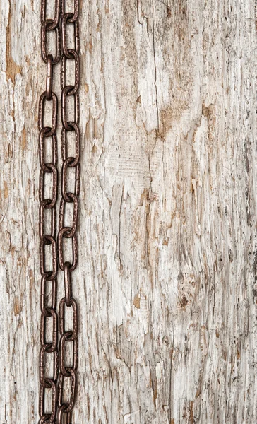 Metal chain on the old wood — Stock Photo, Image