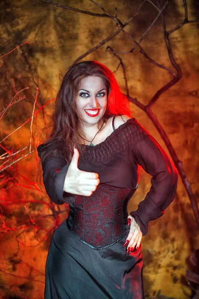 Halloween witch showing thumbs up — Stock Photo, Image