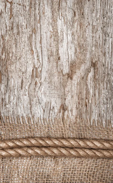 Touw en jute textiel op het oude hout — Stockfoto