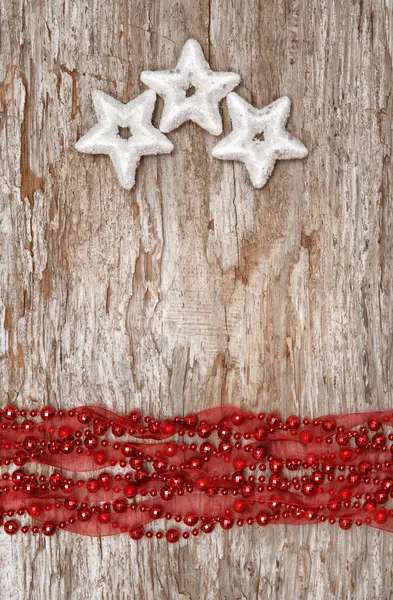 Jul bakgrund med stjärna former och halsband — Stockfoto
