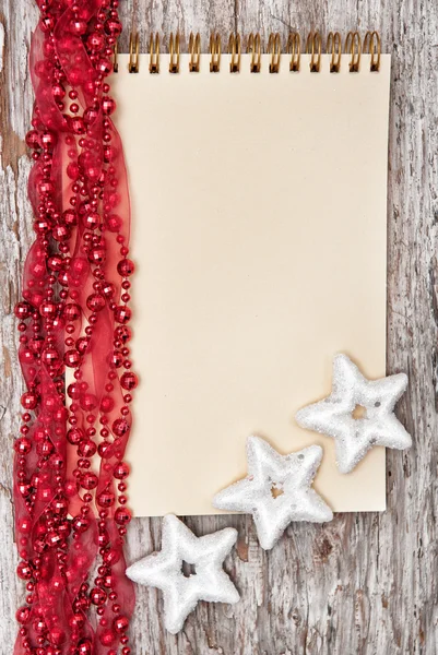 Christmas background with notebook and garland — Stock Photo, Image