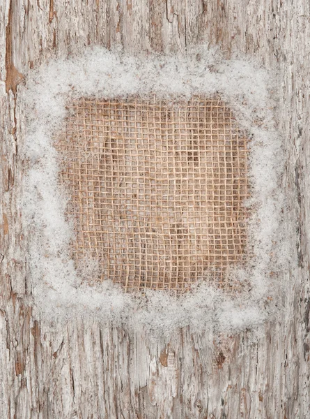 Christmas decoration with burlap textile and snow — Stock Photo, Image