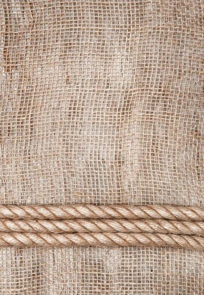 Burlap background with rope — Stock Photo, Image