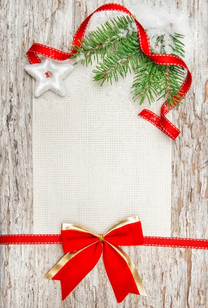 Noel kartı ile kırmızı kurdele, star ve köknar dalı — Stok fotoğraf