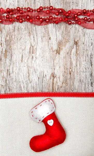 Decoración navideña con calcetín rojo, cinta y lona —  Fotos de Stock