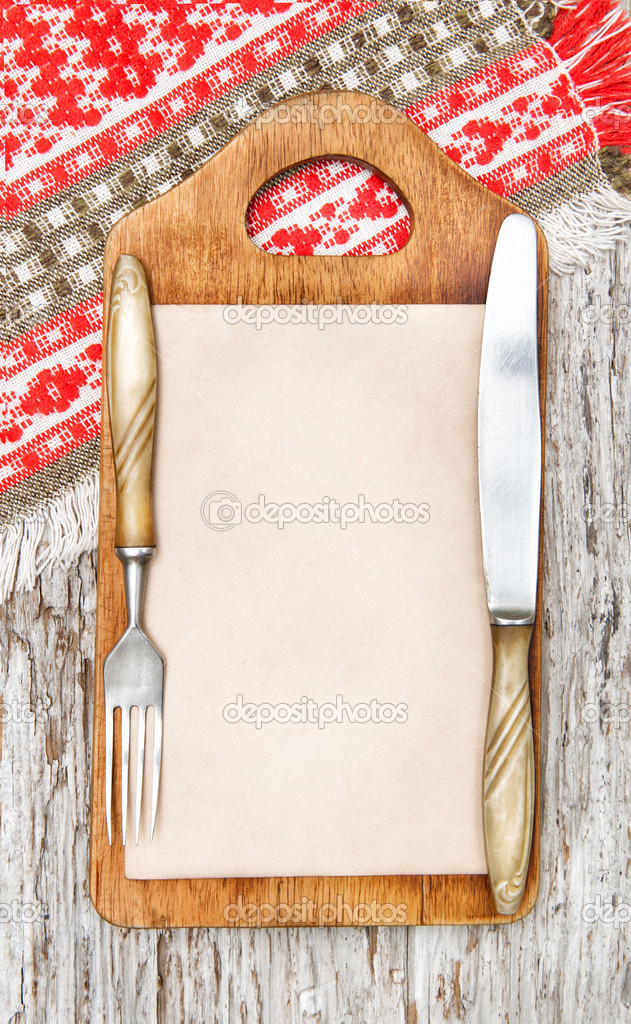 Kitchen cutting board and aged paper