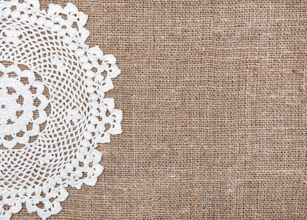 Burlap background with lacy cloth