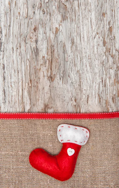 Décoration de Noël avec chaussette rouge et toile de jute — Photo