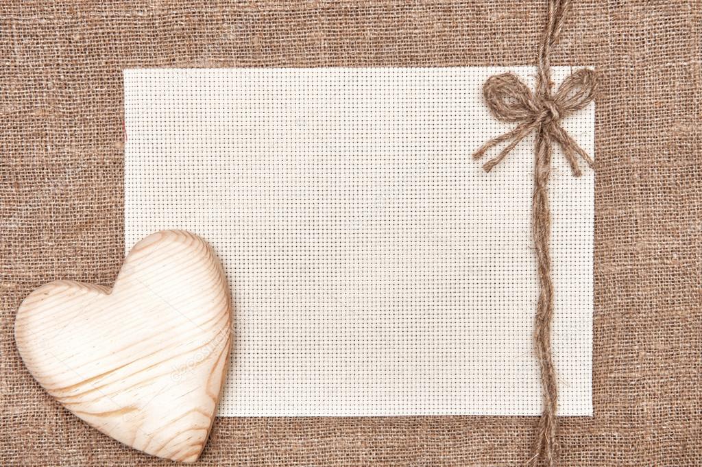 Valentine card with wooden heart and canvas