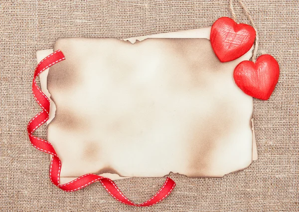 Valentine card with red wooden hearts — Stock Photo, Image