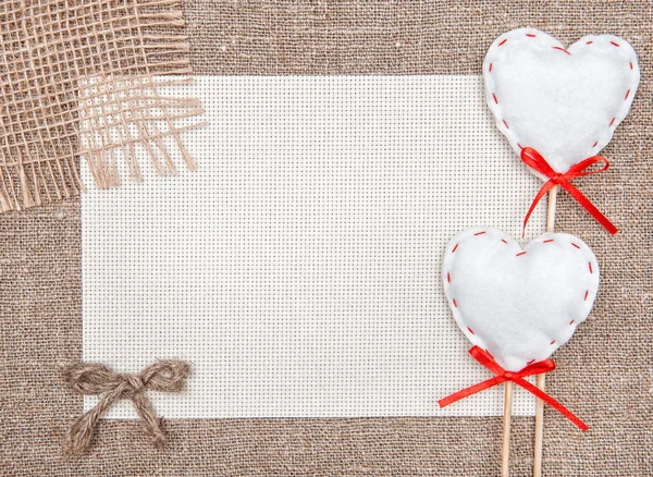 Valentine card with textile hearts and sacking — Stock Photo, Image