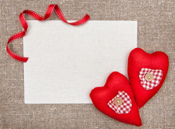 Valentine card with red textile hearts — Stock Photo, Image