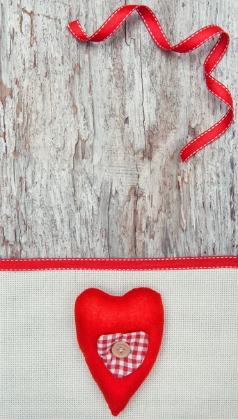 Valentine card with textile heart on canvas — Stock Photo, Image