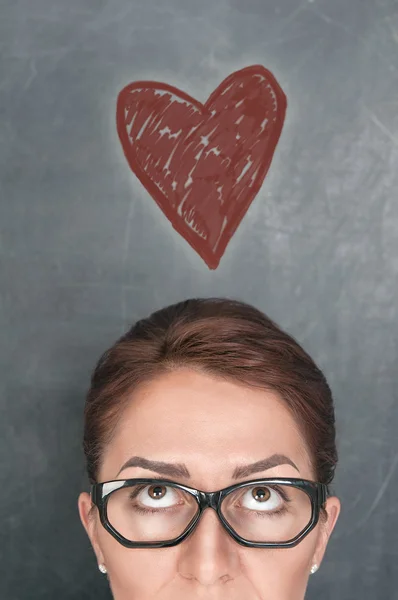 Concept of woman face with heart — Stock Photo, Image