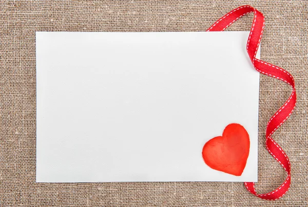 Valentine card with drawing red heart on burlap — Stock Photo, Image