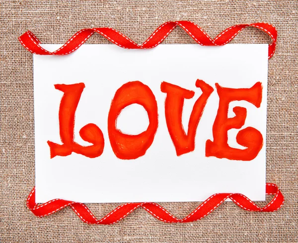 Valentine card with drawing word love and ribbon — Stock Photo, Image