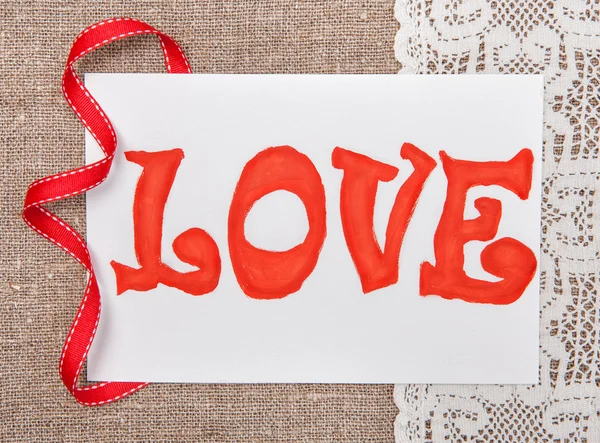 Valentine card with drawing word love on lace — Stock Photo, Image