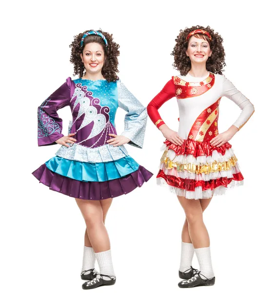 Two young women in Irish dance dresses posing isolated — Stock Photo, Image