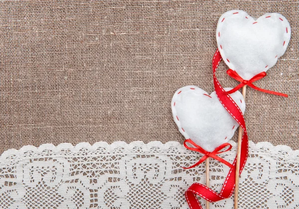 Valentine card with textile hearts and lacy cloth — Stock Photo, Image