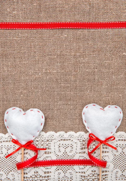 Valentine card with textile hearts and lacy cloth — Stock Photo, Image