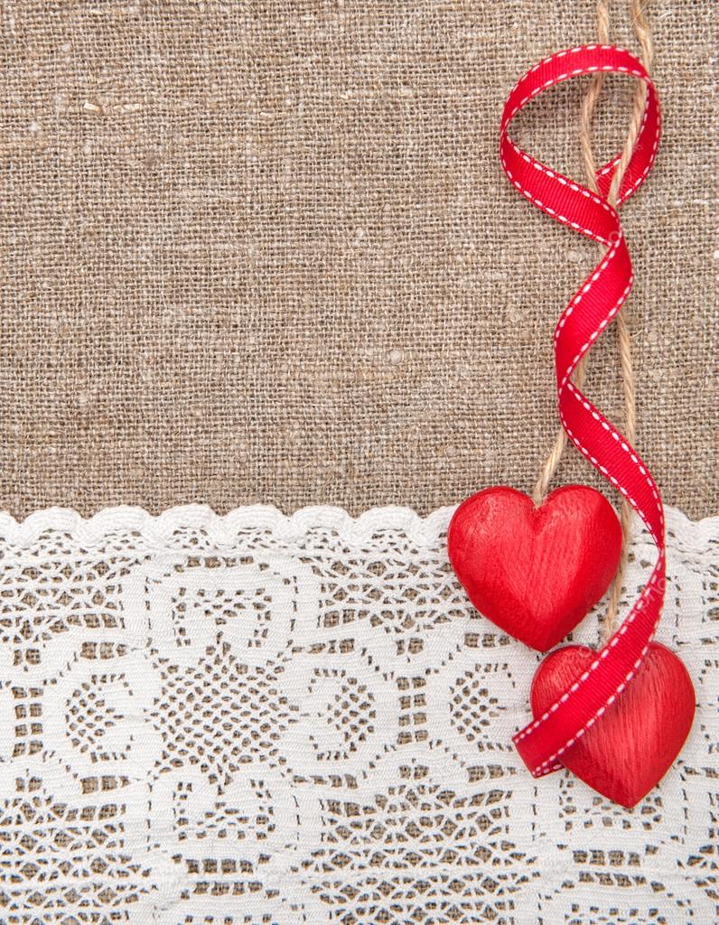 Valentine card with wooden hearts and lacy cloth