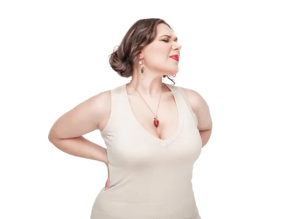 Plus size woman with pain in her back — Stock Photo, Image