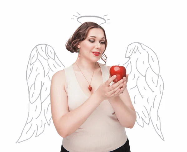 Beautiful plus size woman as angel with apple — Stock Photo, Image