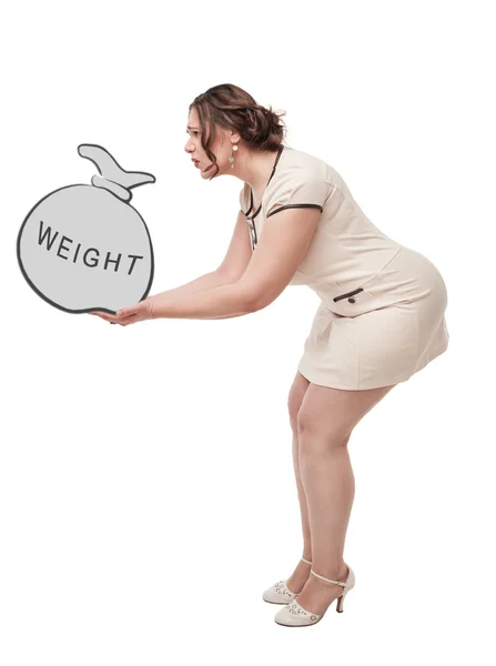 Beautiful plus size woman holding bag with word weight — Stock Photo, Image