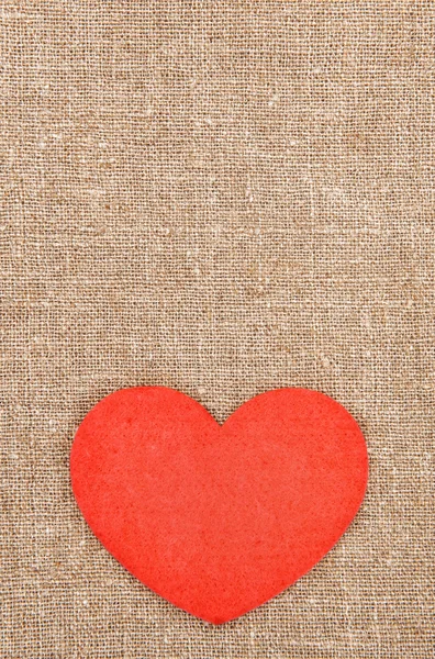 Felt red heart on the burlap — Stock Photo, Image