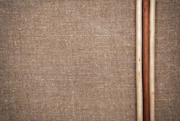 Burlap linen with wooden sticks — Stock Photo, Image
