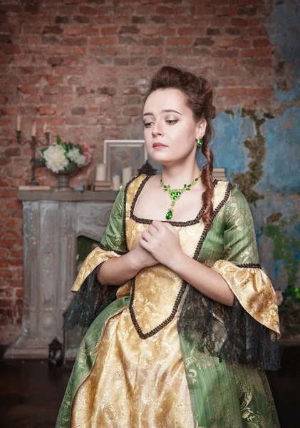 Sad beautiful woman in medieval dress — Stock Photo, Image