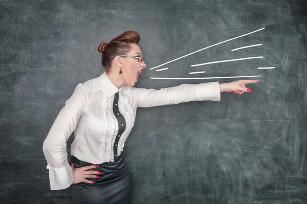 Angry screaming teacher pointing out — Stock Photo, Image