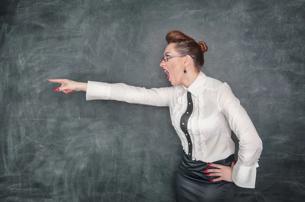 Angry teacher pointing out — Stock Photo, Image