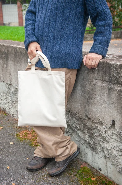 Stylish Man Holding White Blank Canvas Tote Shopping Bag Outdoor — Stock Photo, Image