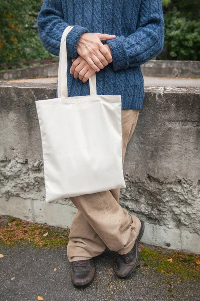 Stylish Man Holding White Blank Canvas Tote Shopping Bag Outdoor — Stock Photo, Image