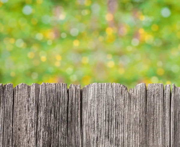 Empty rustic wooden board with abstract summer background