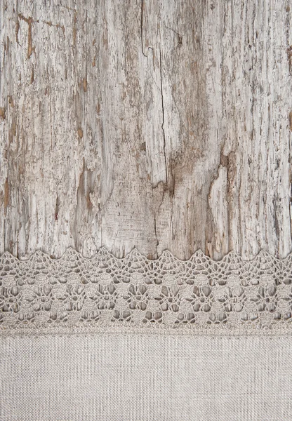 Laço e tecido de linho na madeira velha — Fotografia de Stock