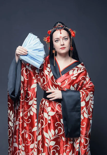 Beautiful Young Woman Red Traditional Chinese Costume Holding Medical Protective — стокове фото