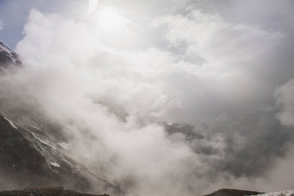 Beautiful mountain landscape with snow in fog and cloud outdoor