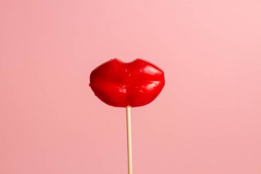 Valentine concept. Red Lip-shaped Lollipop.