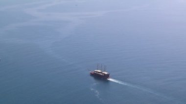 A large ship is sailing in the open sea