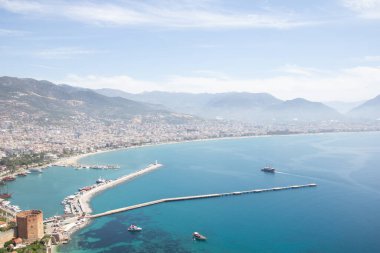 View of Alanya harbor. Red Tower and port aerial panoramic view in Alanya city.